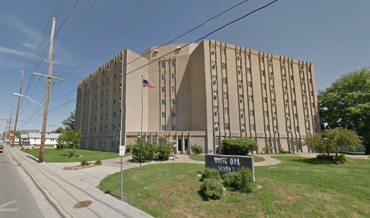 a large building with an flag in front of it